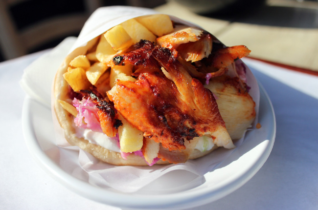 meat, chips and salad wrapped in pita bread