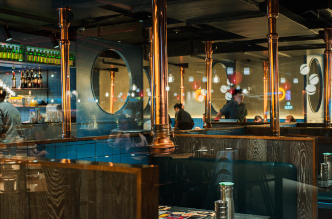 the inside of a sleek Korean BBQ restaurant