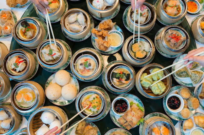 a selection of steamed rice, sauces and pork buns